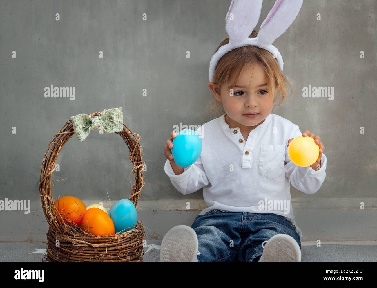 Happy Baby Boy with Easter Eggs Stock Photo