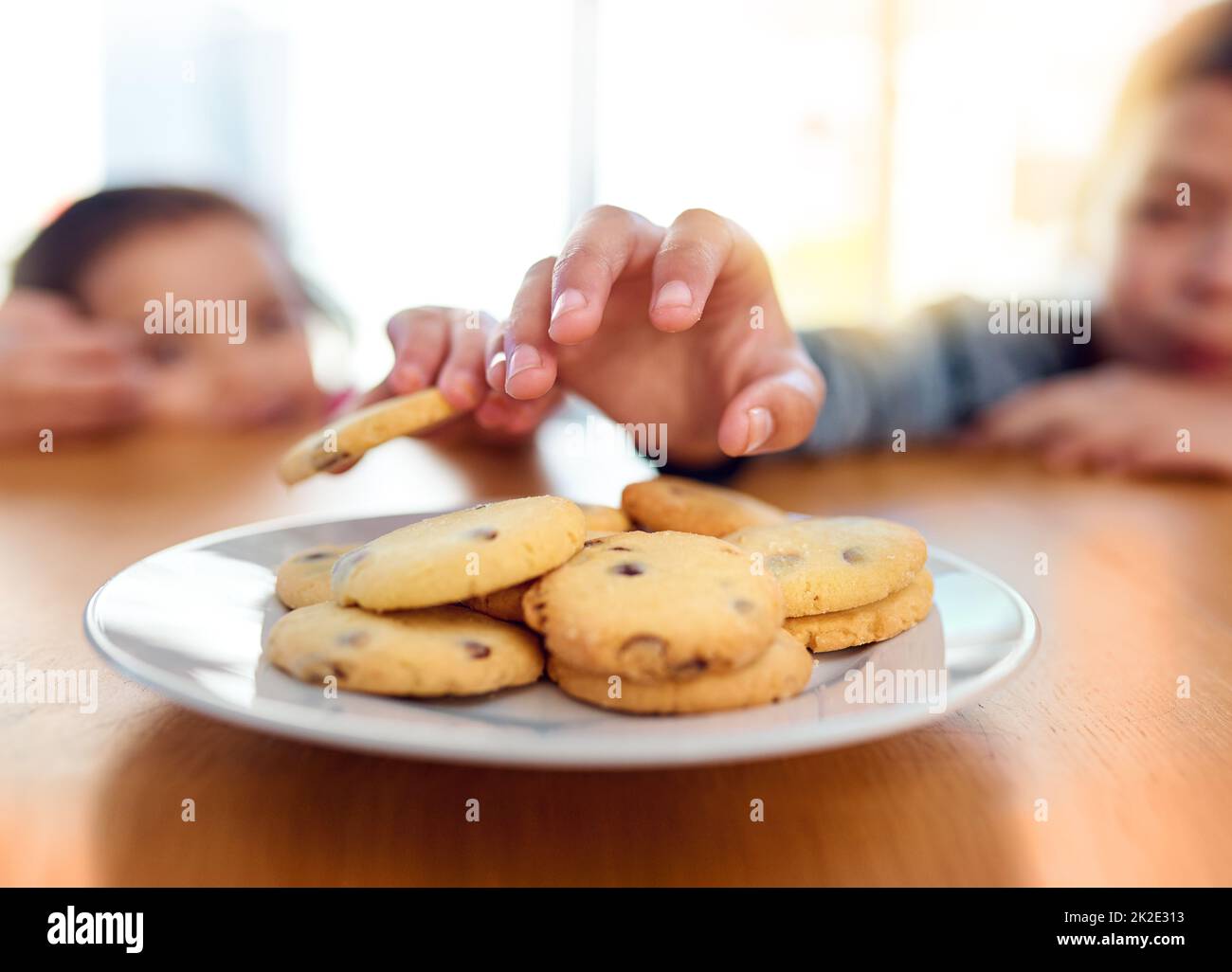 Little girl stealing cookies hi-res stock photography and images - Alamy