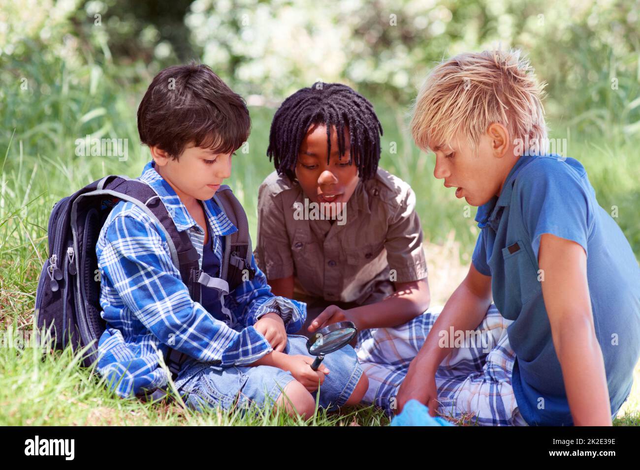 Three little adventurers. Three little boys spending time outdoors together. Stock Photo
