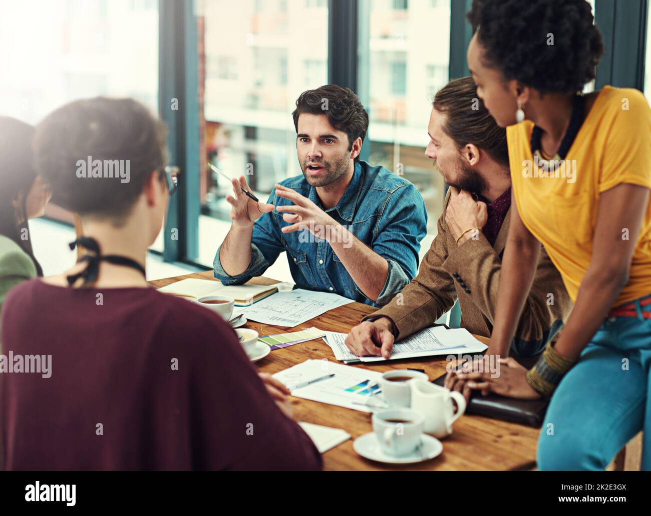Directing his team to success. Cropped shot of a group of young