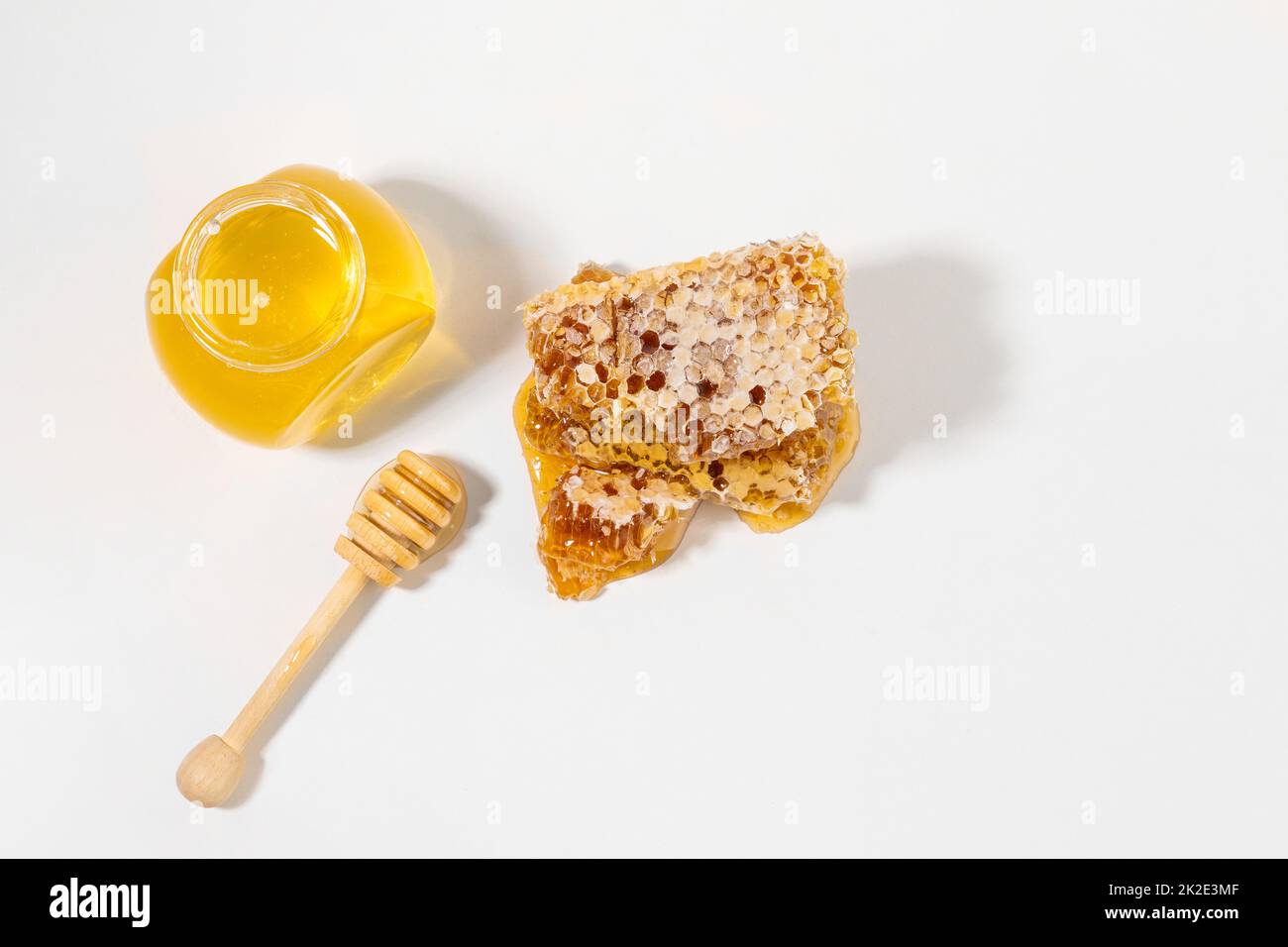 bottled honey, honey dipper stick Stock Photo Alamy