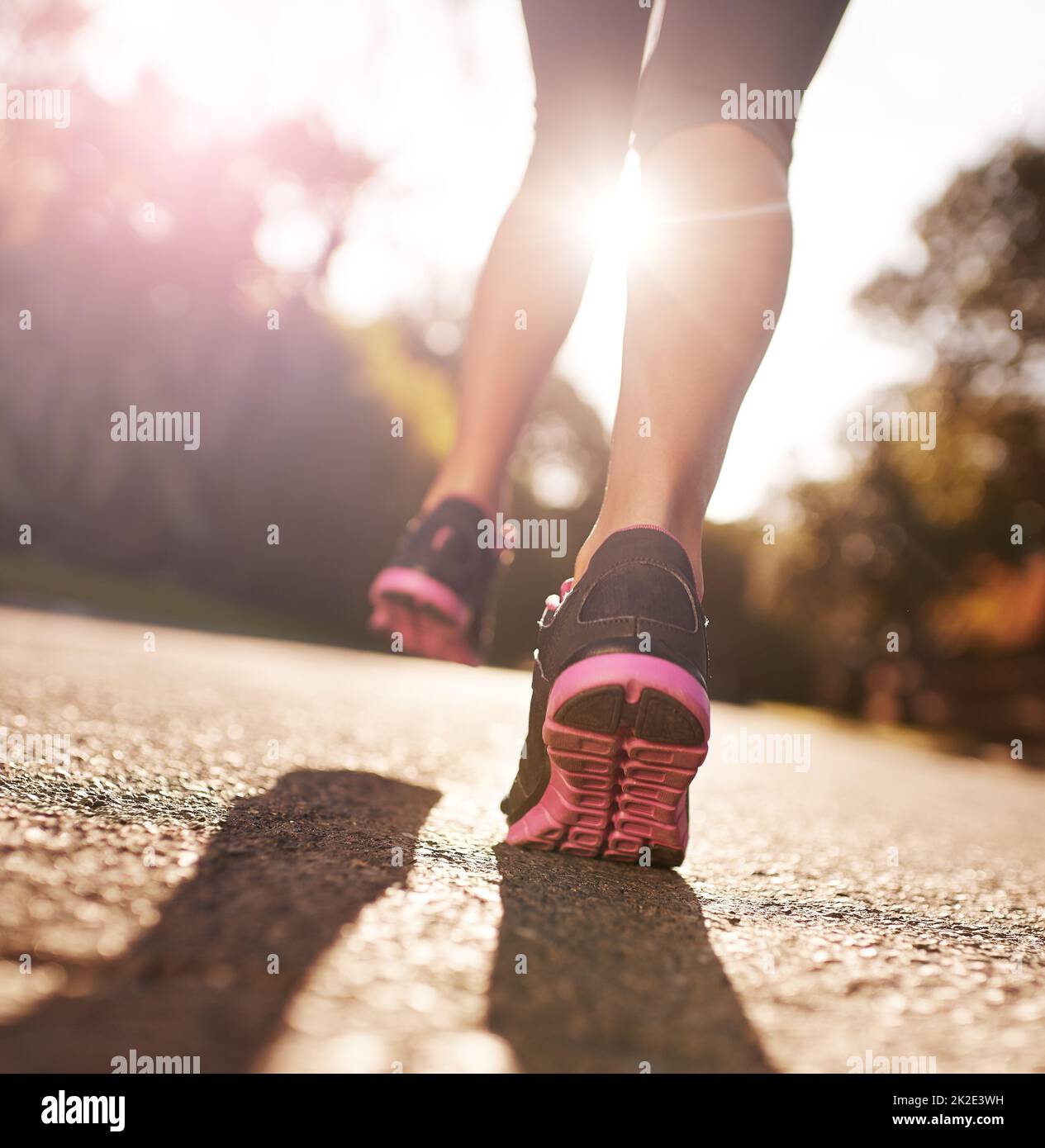 In it for the long run. Cropped shot of a womans legs out for a run. Stock Photo