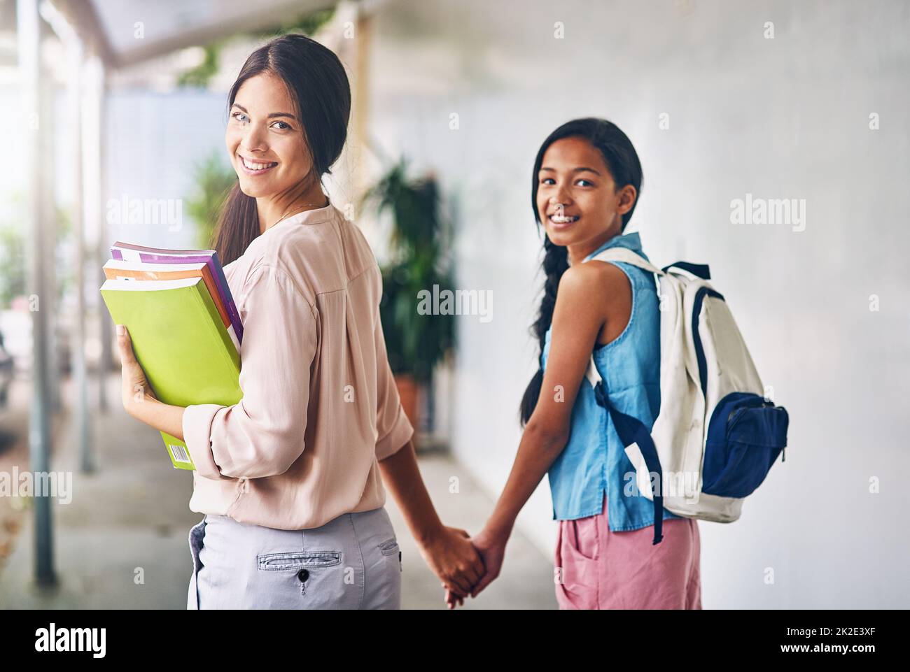 Were headed to class. Portrait of an attractive young teacher walking