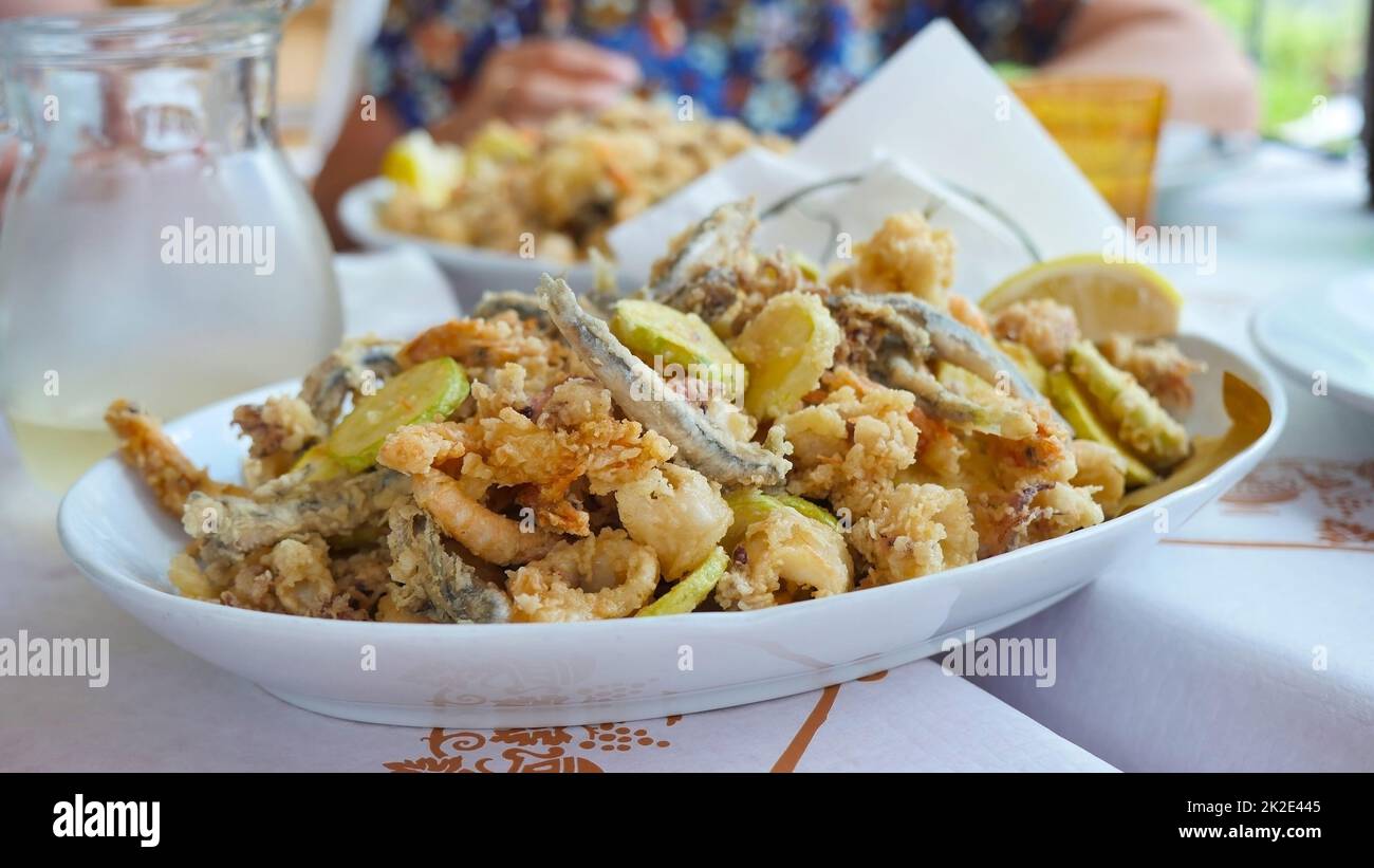 Tasty Italian dish fried seafood: shrimp, squid, octopus and slices of