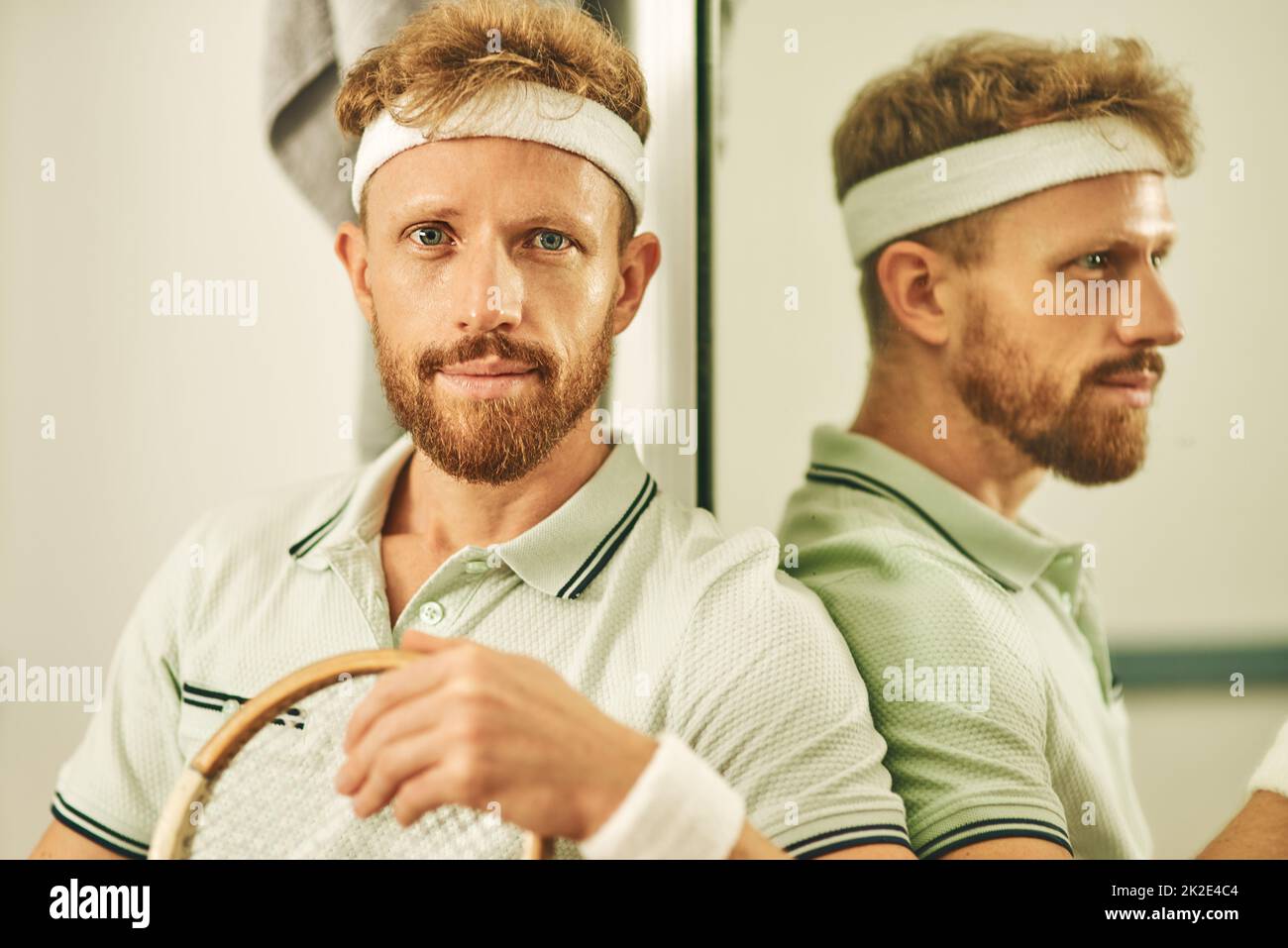 Squash, like tennis but better. Shot of a young man in the locker room after a game of squash. Stock Photo
