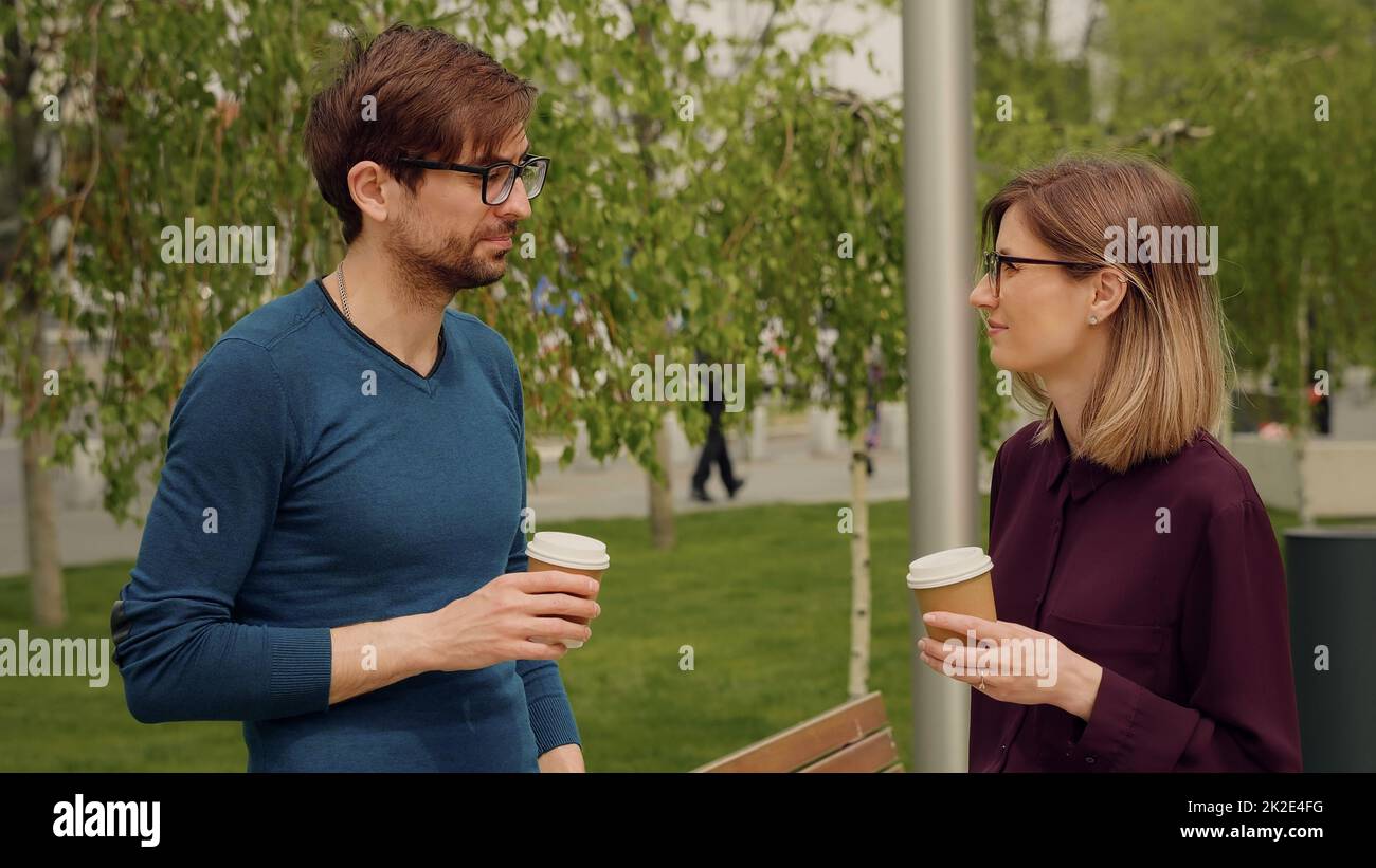 Two colleagues employees discussing planning during break out of office. Stock Photo