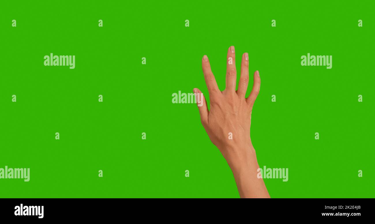 Gestures pack. Female hand touching, clicking, tapping, sliding, dragging and swiping on chroma key green screen background. Using a smartphone, tablet pc or a touchscreen. Stock Photo