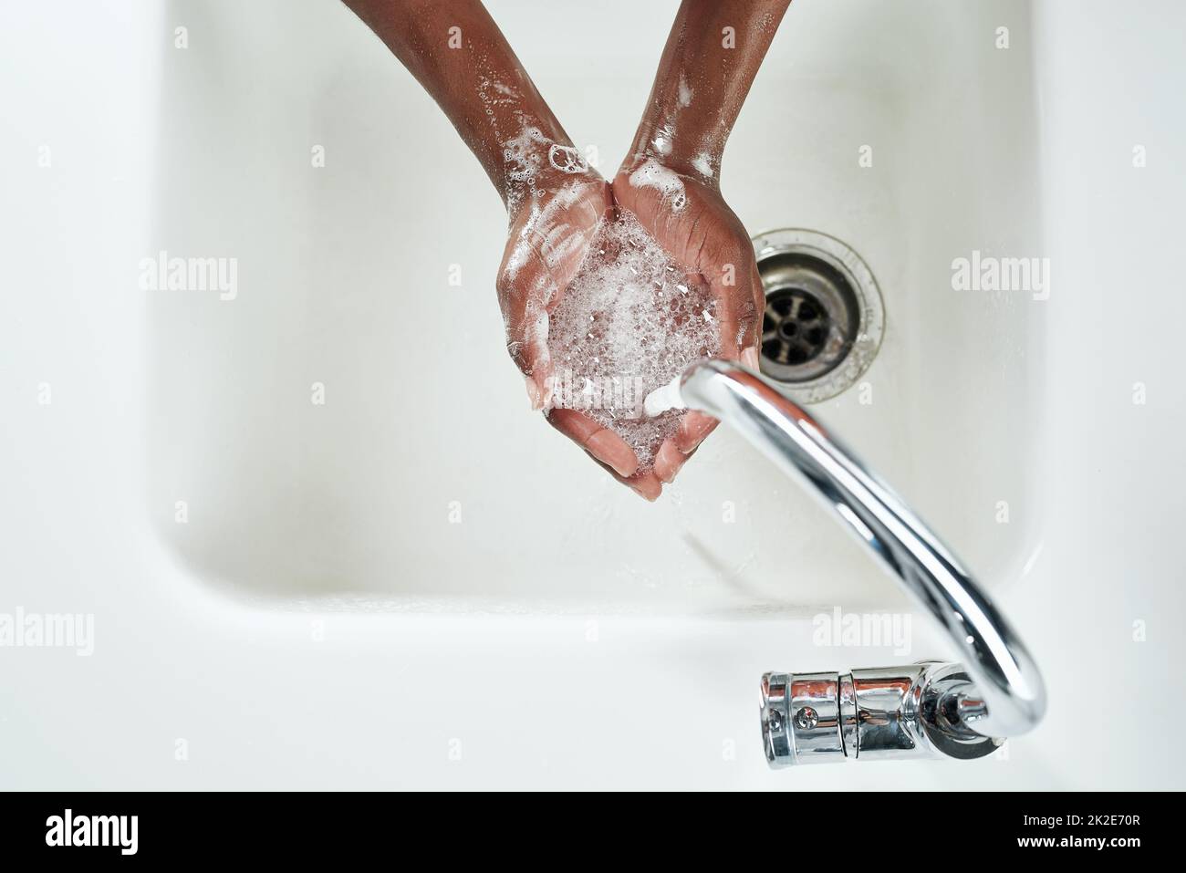 Freshening up. Shot of hands being washed at a tap. Stock Photo