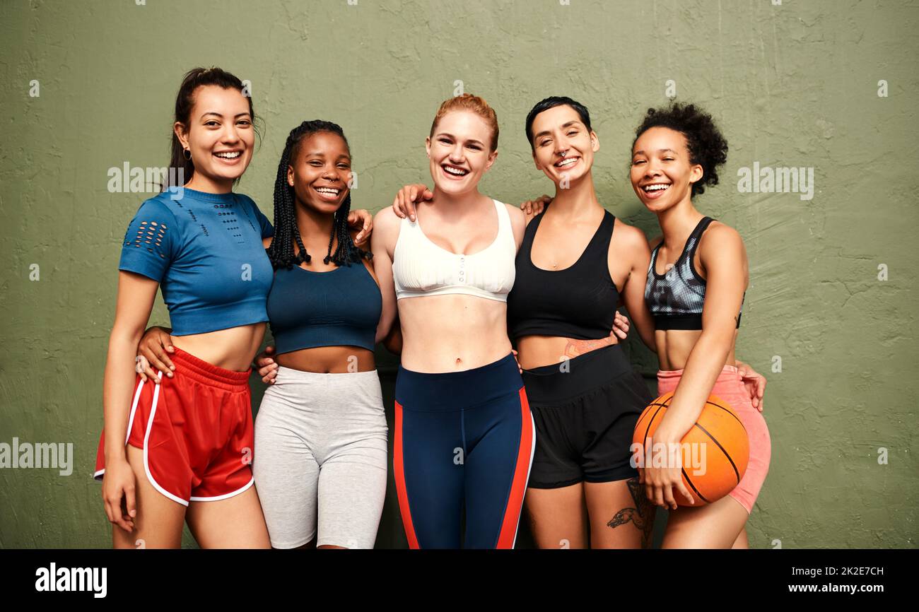 We are the definition of team spirit. Cropped shot of a diverse group of sportswomen standing together after a basketball game during the day. Stock Photo