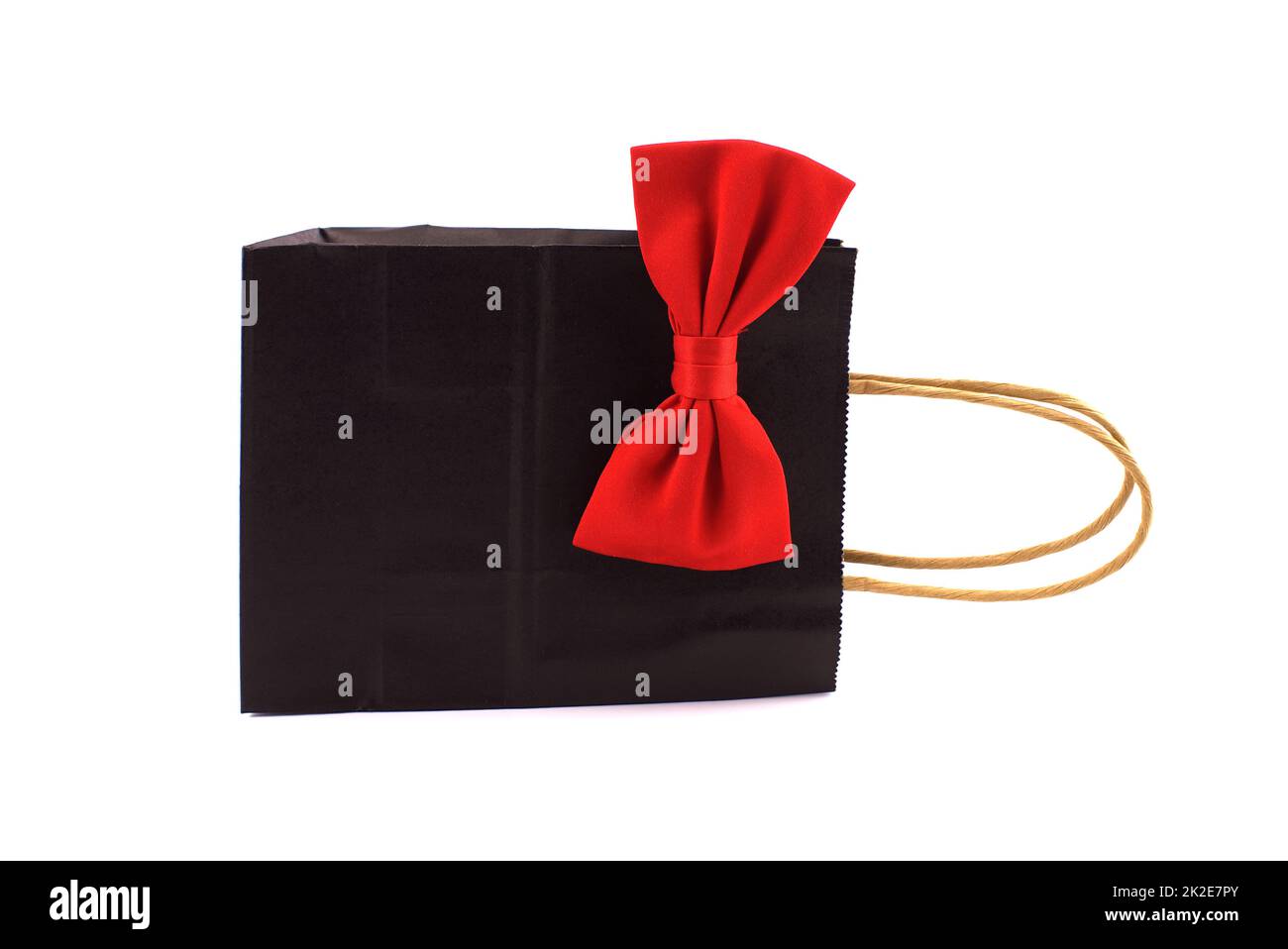 Black paper shopping bag with red bow tie Stock Photo