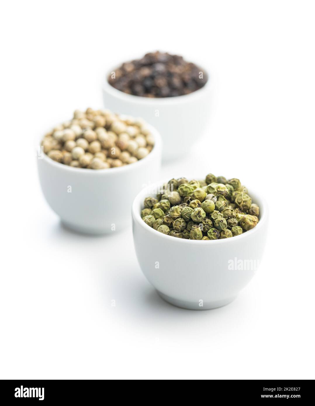 Three different types of pepper spice. Green, white and black