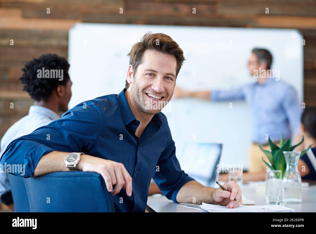 Making my creativity work for me. Portrait of a handsome creative professional smiling at the camera in a modern conference room. Stock Photo