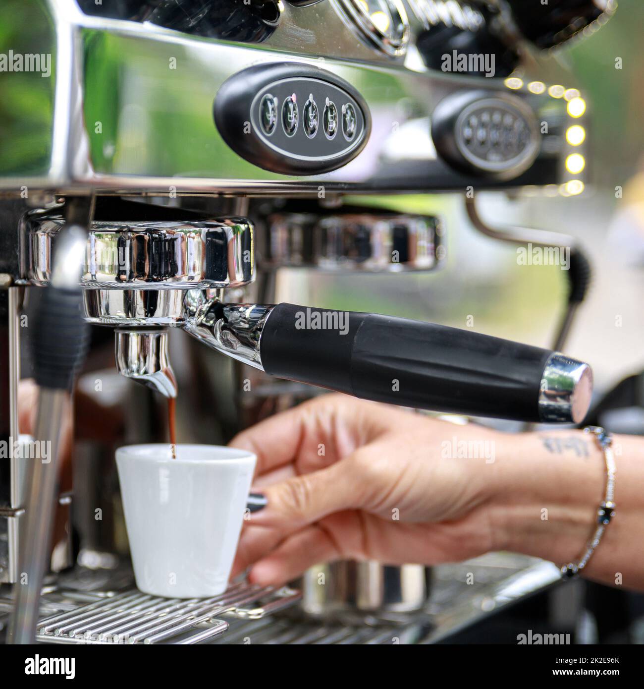 Barista making coffee using professional espresso machine Stock Photo