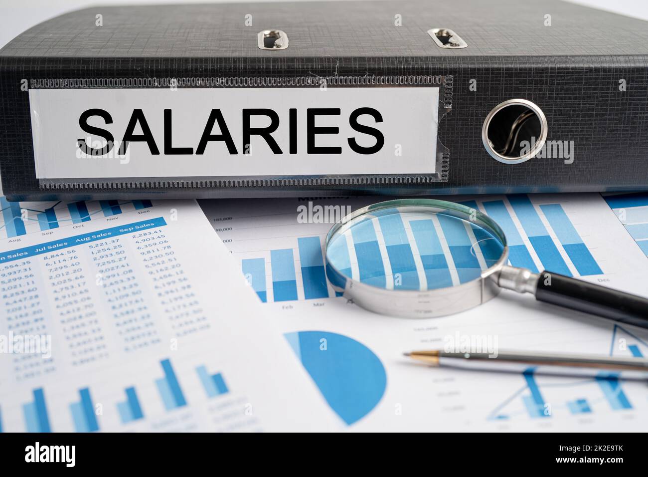 Salaries. Binder data finance report business with graph analysis in office Stock Photo Alamy