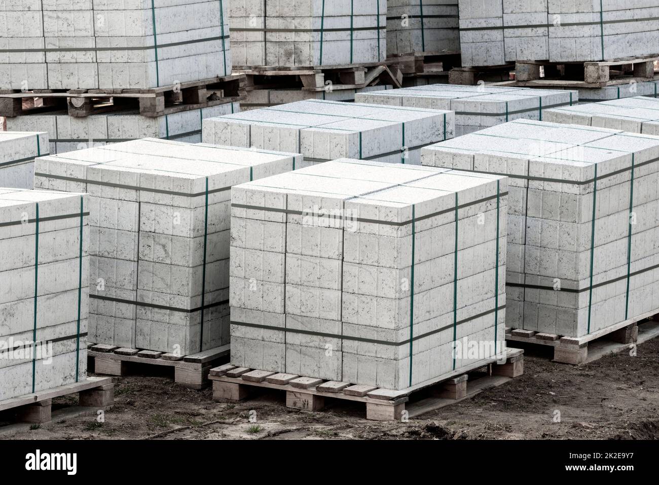 Concrete pavement tiles stacked on the wooden pallets Stock Photo