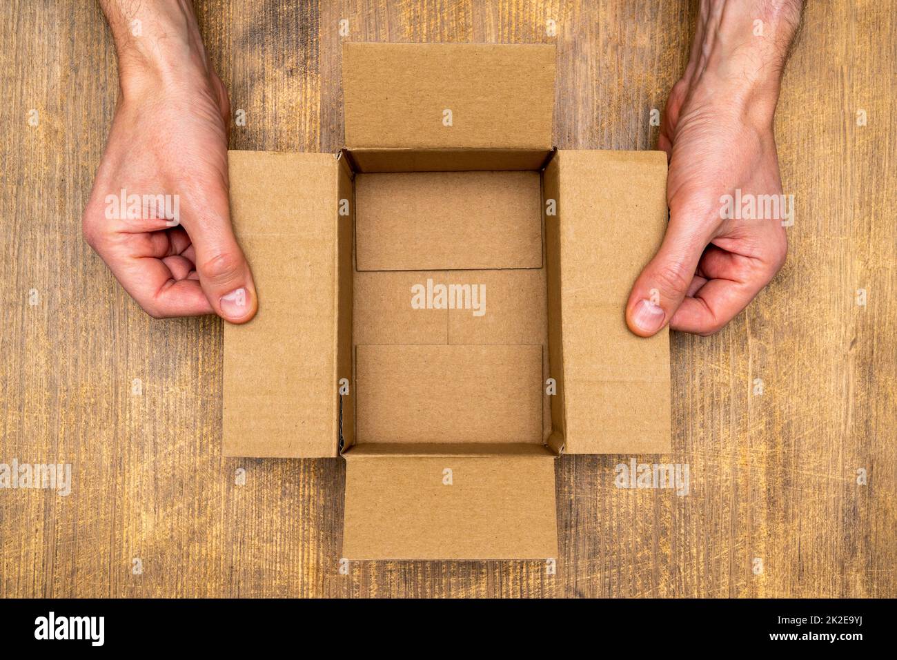 Hands opening cardboard box hi-res stock photography and images - Alamy