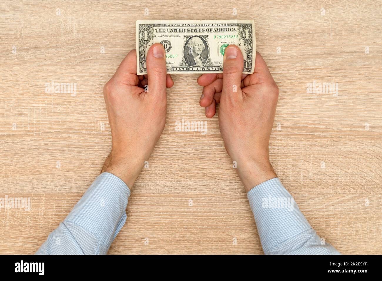One dollar banknote in male hands Stock Photo