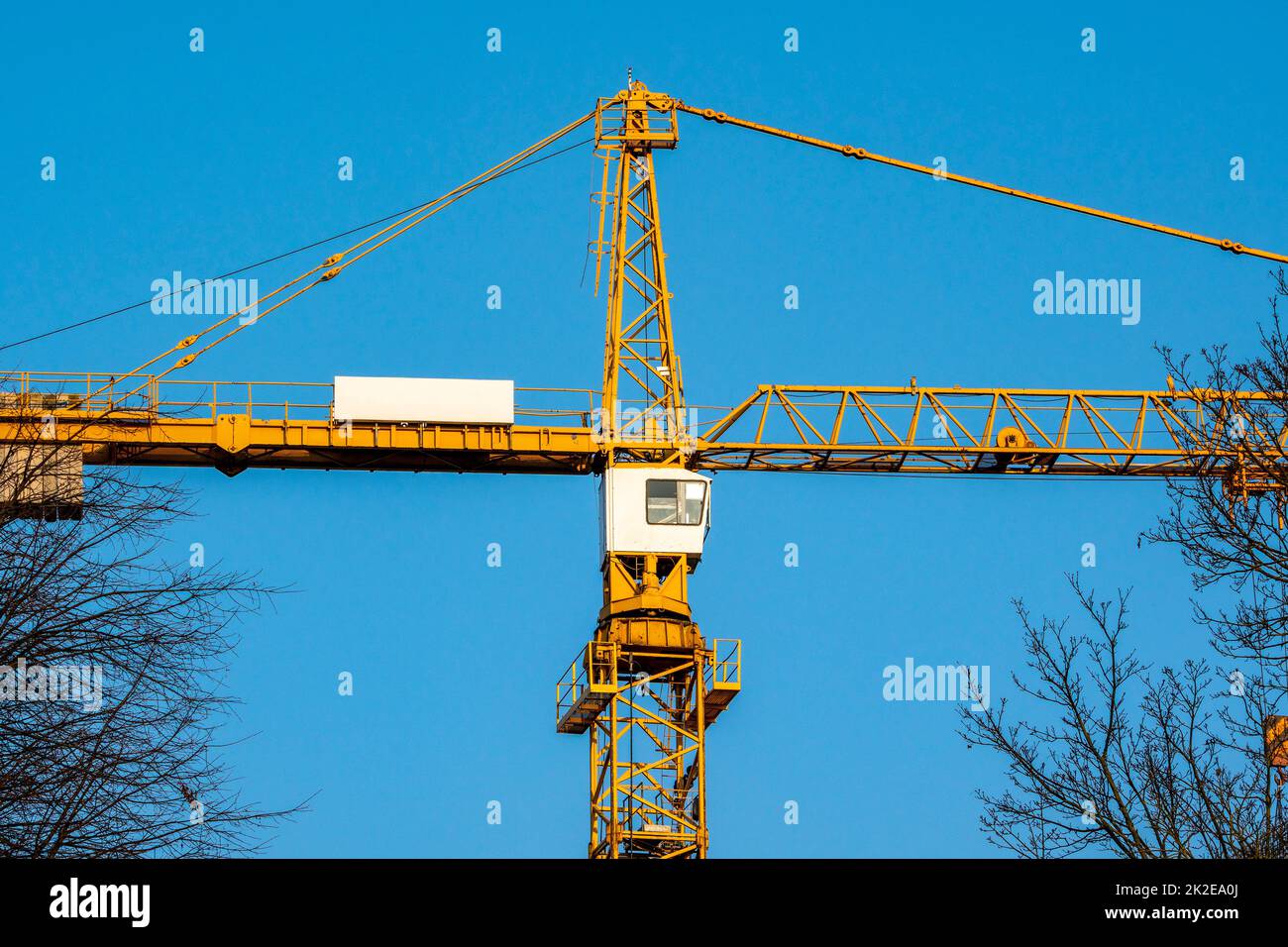 Yellow construction tower crane Stock Photo