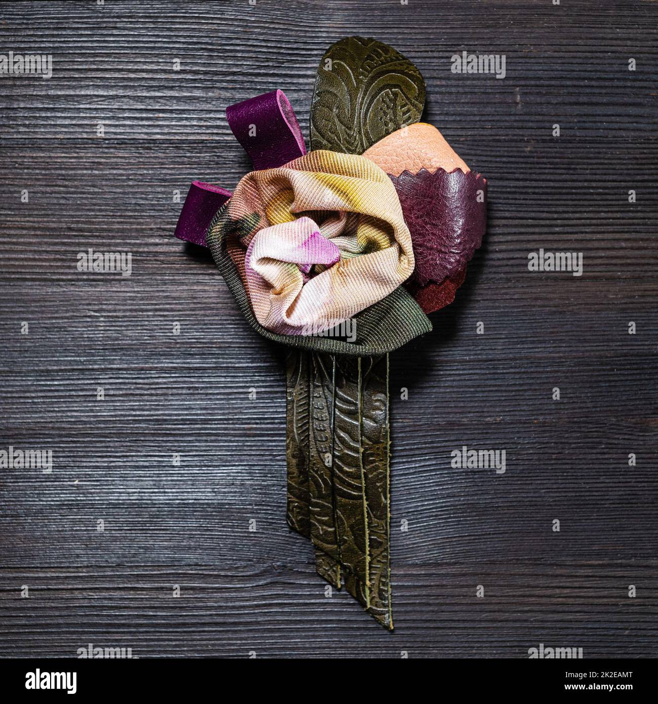 top view of leather and silk brooch as rose flower Stock Photo