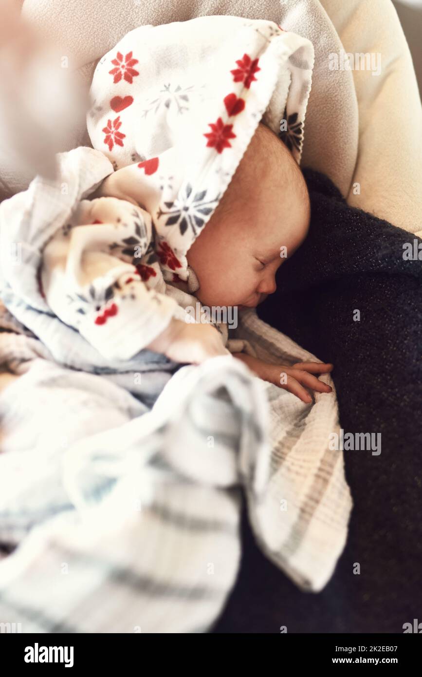 Fast asleep. High angle shot of a tired little infant child sleeping on