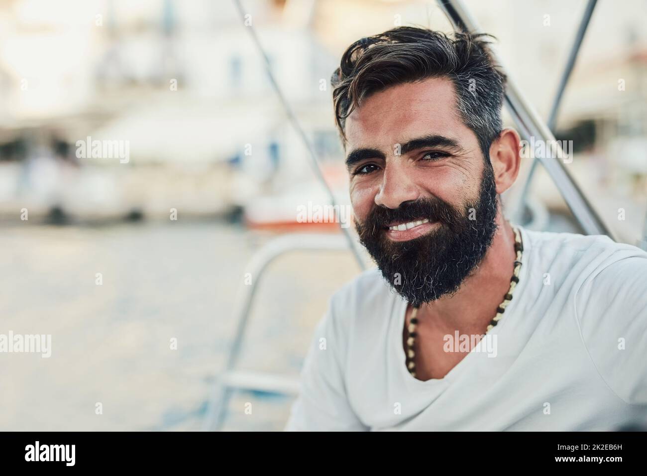 Out here is my happy place. Cropped shot of a handsome mature man on his yacht. Stock Photo