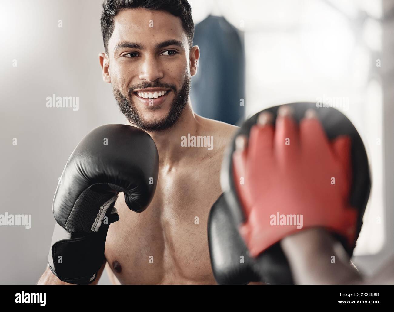 Boxing man, fight training and coach workout for strong power, happy mma challenge and gym club sparring exercise for combat sports. Fitness champion Stock Photo