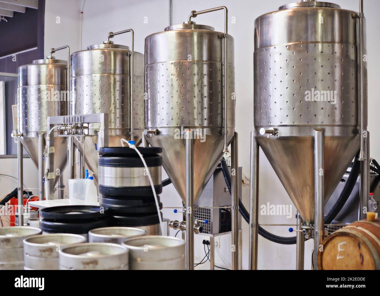 The fermentation process. Shot of steel tanks in a brewery Stock Photo