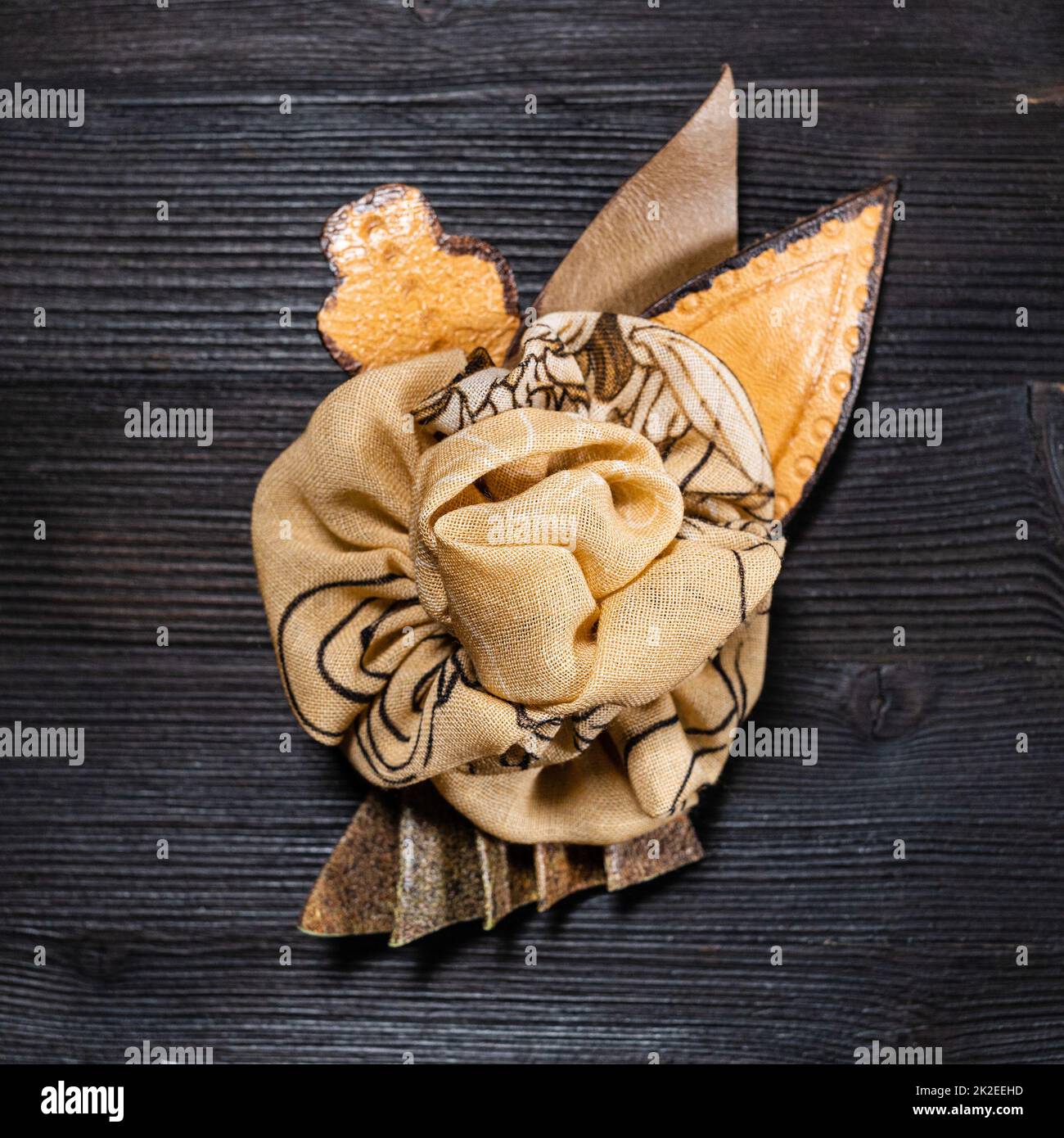 top view brown leather and silk brooch as flower Stock Photo