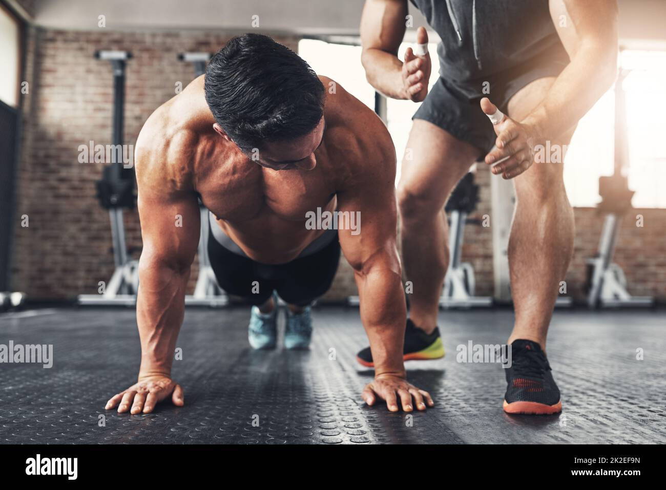 Time and dedication gets results. Shot of a muscular young man working