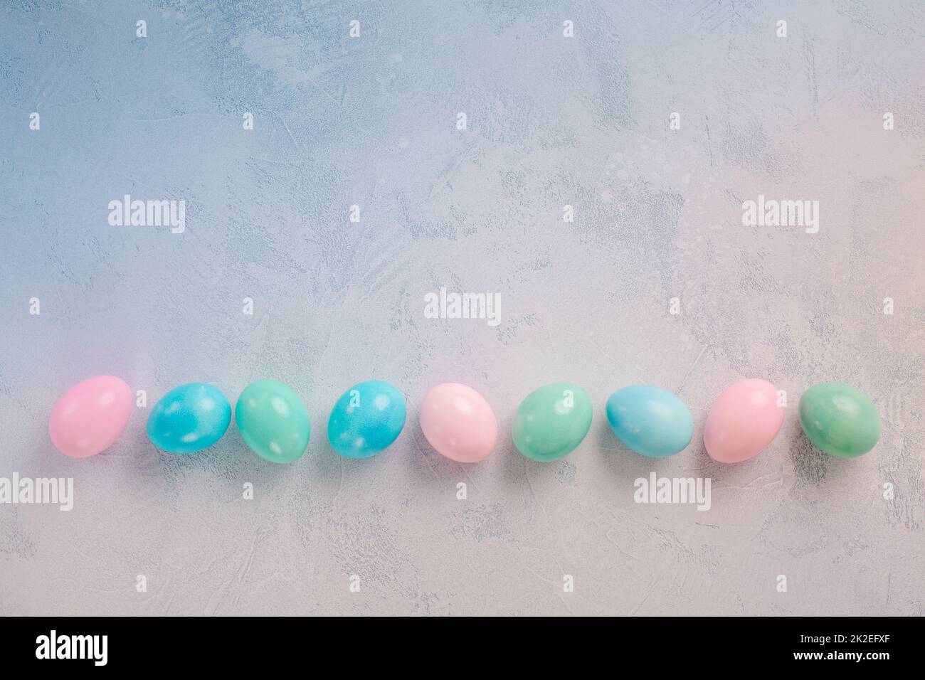 Row of Easter eggs in row with copy space Stock Photo