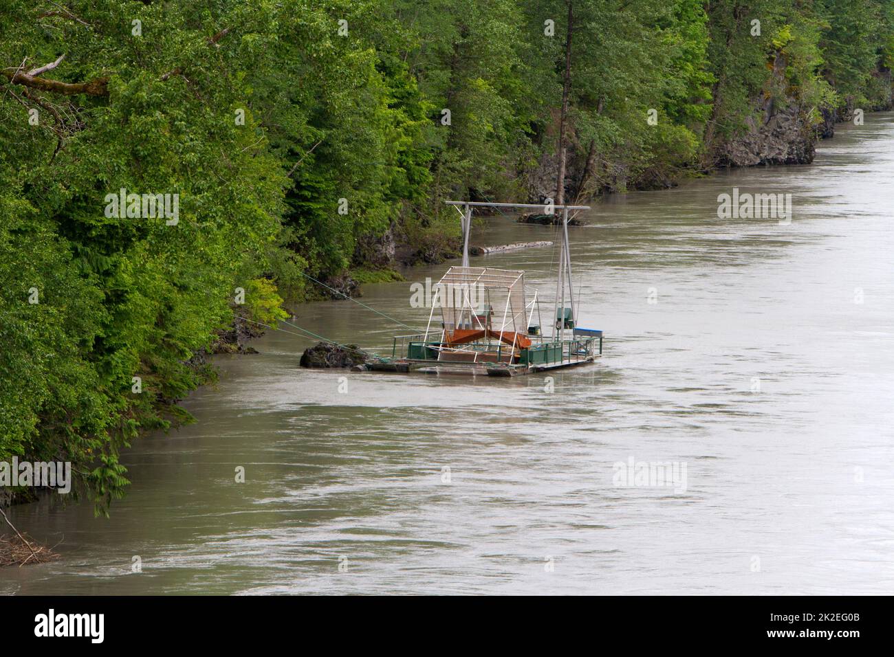 A fish wheel for counting salmon along the Nass River in northern British Columbia, Canada and managed by the Nisga'a Fisheries Board. Stock Photo