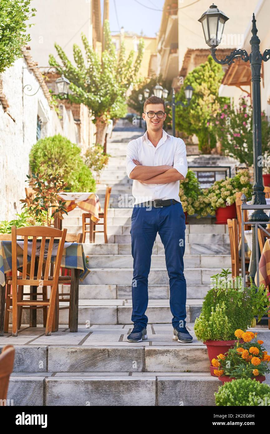 Youve found the best restaurant in town. Shot of a man standing at a restaurant outside. Stock Photo