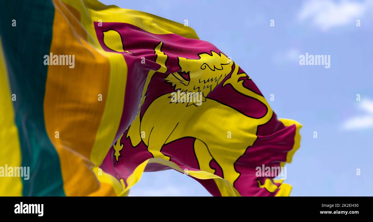 Detail of the national flag of Sri Lanka waving in the wind on a clear ...