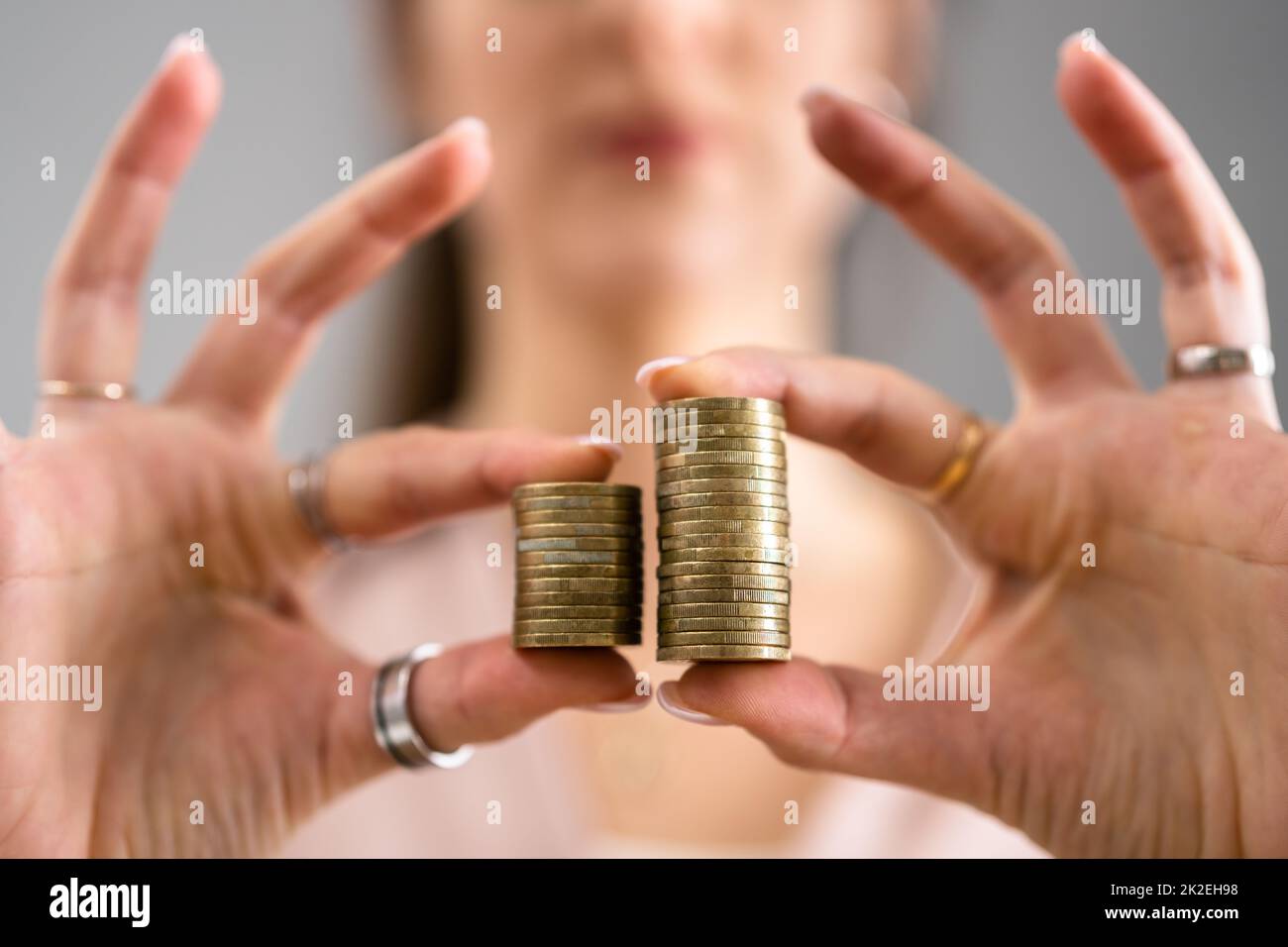 Compare Wage Gap And Tax Differences Stock Photo