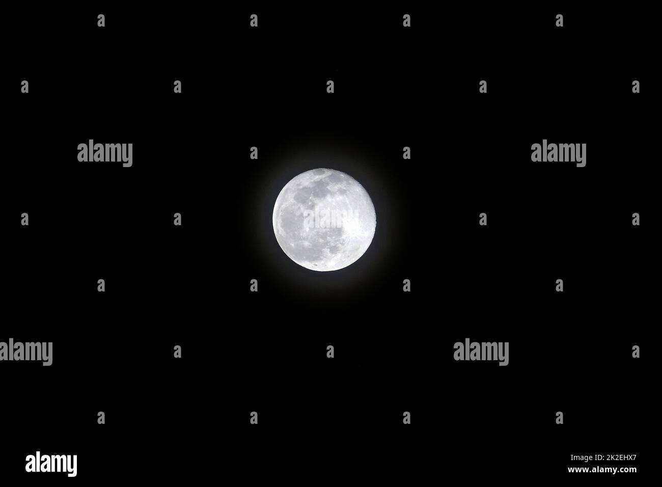 Night and full moon, full moon shining in dark sky, full moon video in 4k quality Stock Photo