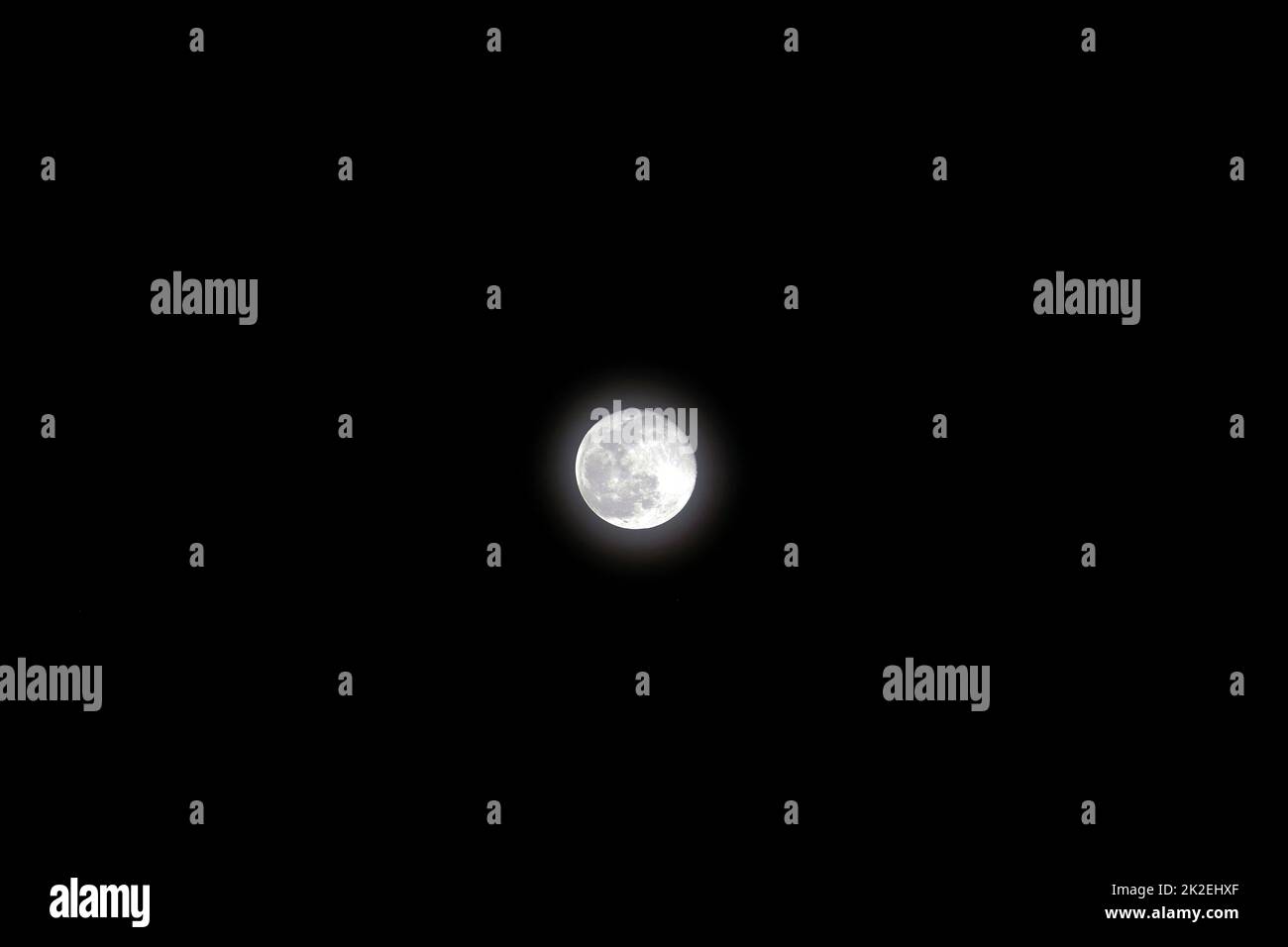 Night and full moon, full moon shining in dark sky, full moon video in 4k quality Stock Photo