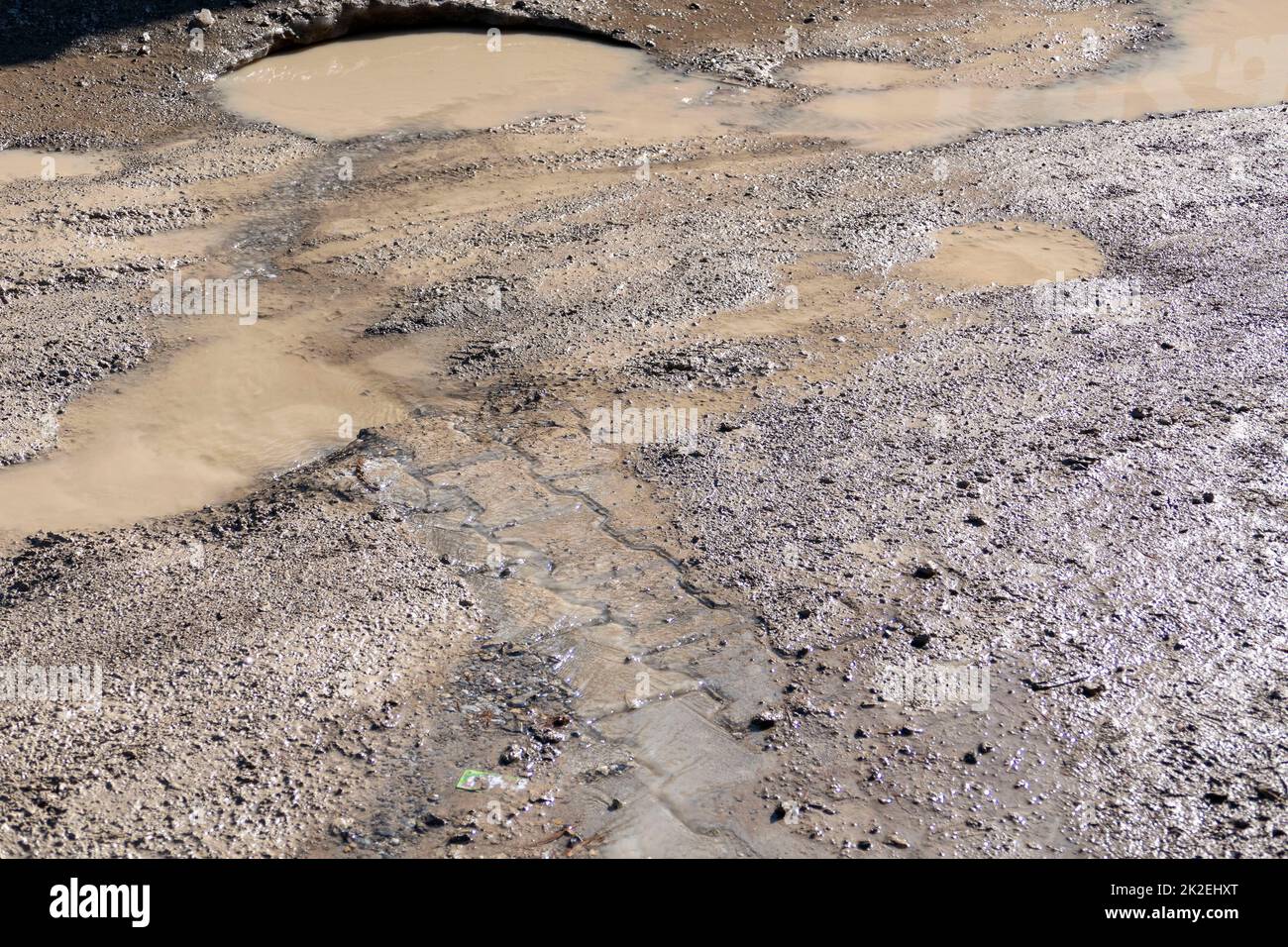 mud and dirty water puddle formed as a result of rain Stock Photo