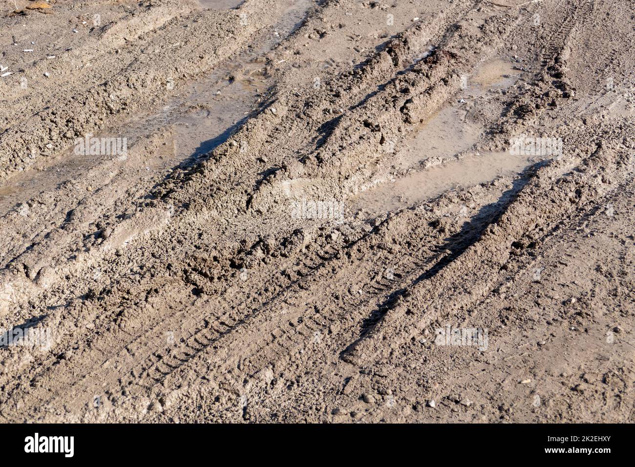 mud and dirty water puddle formed as a result of rain Stock Photo - Alamy