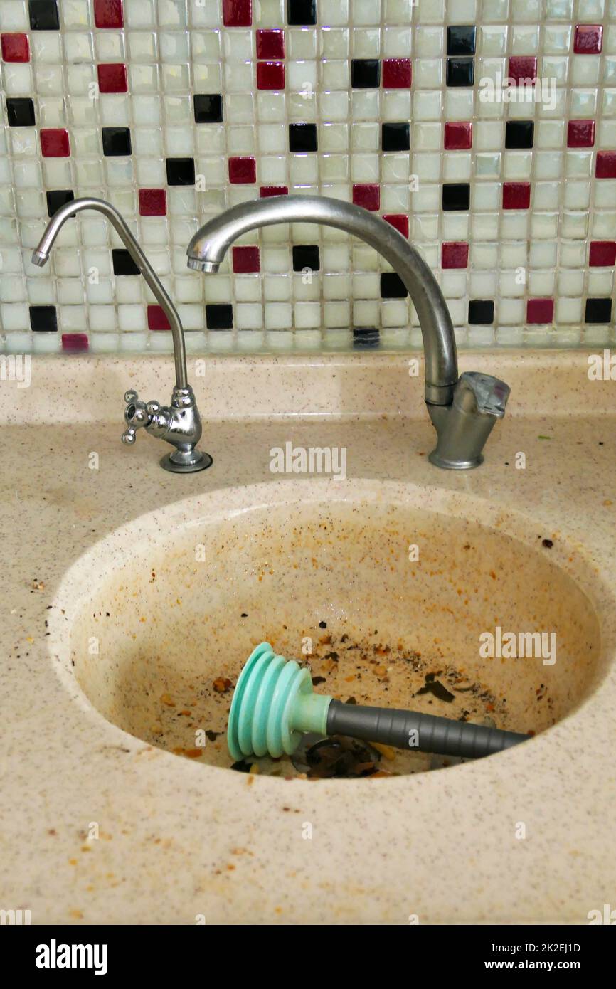 clogging in the kitchen sinkdirty dishwater accumulated in the sink