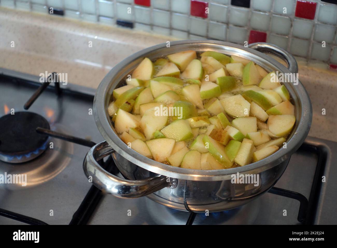 Freshly Chopped Apple Pieces Boiling in a Pot,Making Homemade Apple