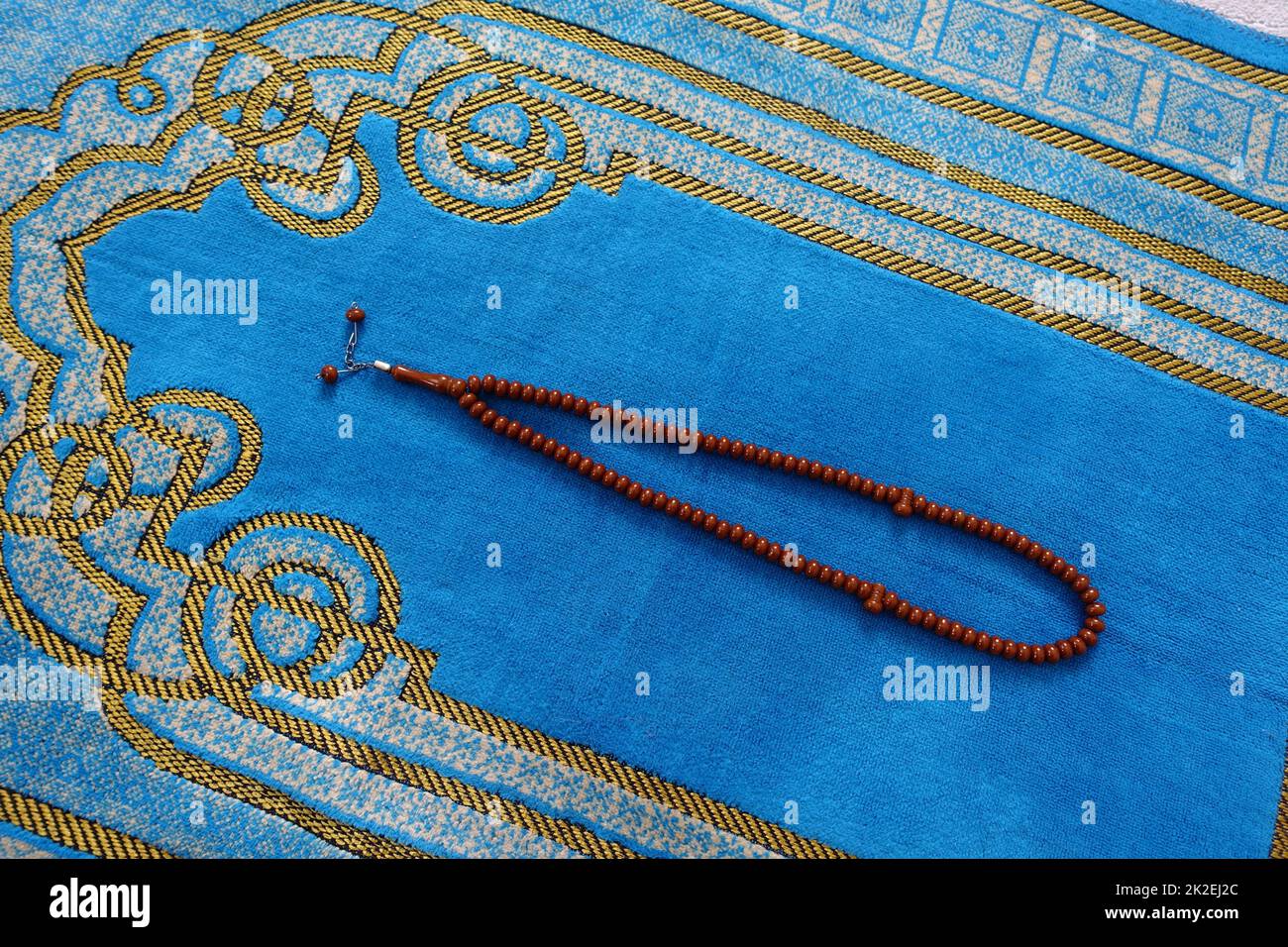 Ramadan month and prayer rug in Islam, prayer rug and rosary for praying in Ramadan Stock Photo
