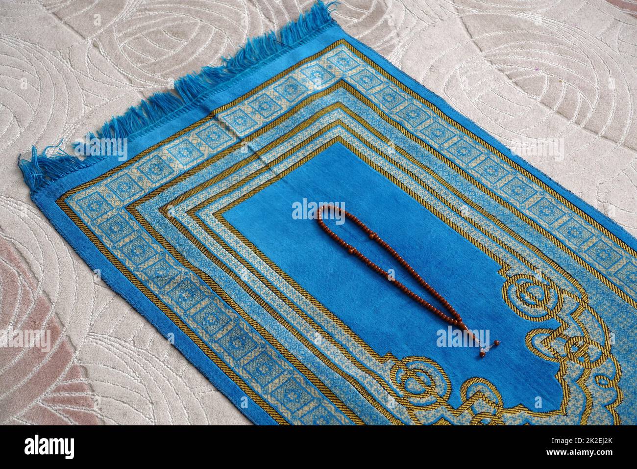 Ramadan month and prayer rug in Islam, prayer rug and rosary for praying in Ramadan Stock Photo