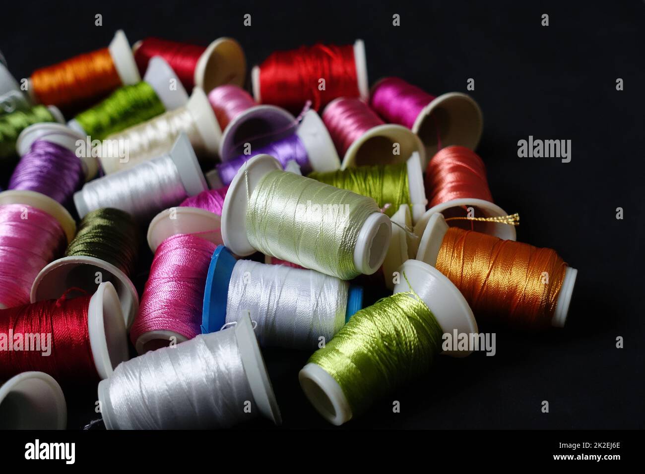 close-up colorful bobbin threads,handcrafted bobbin threads Stock Photo