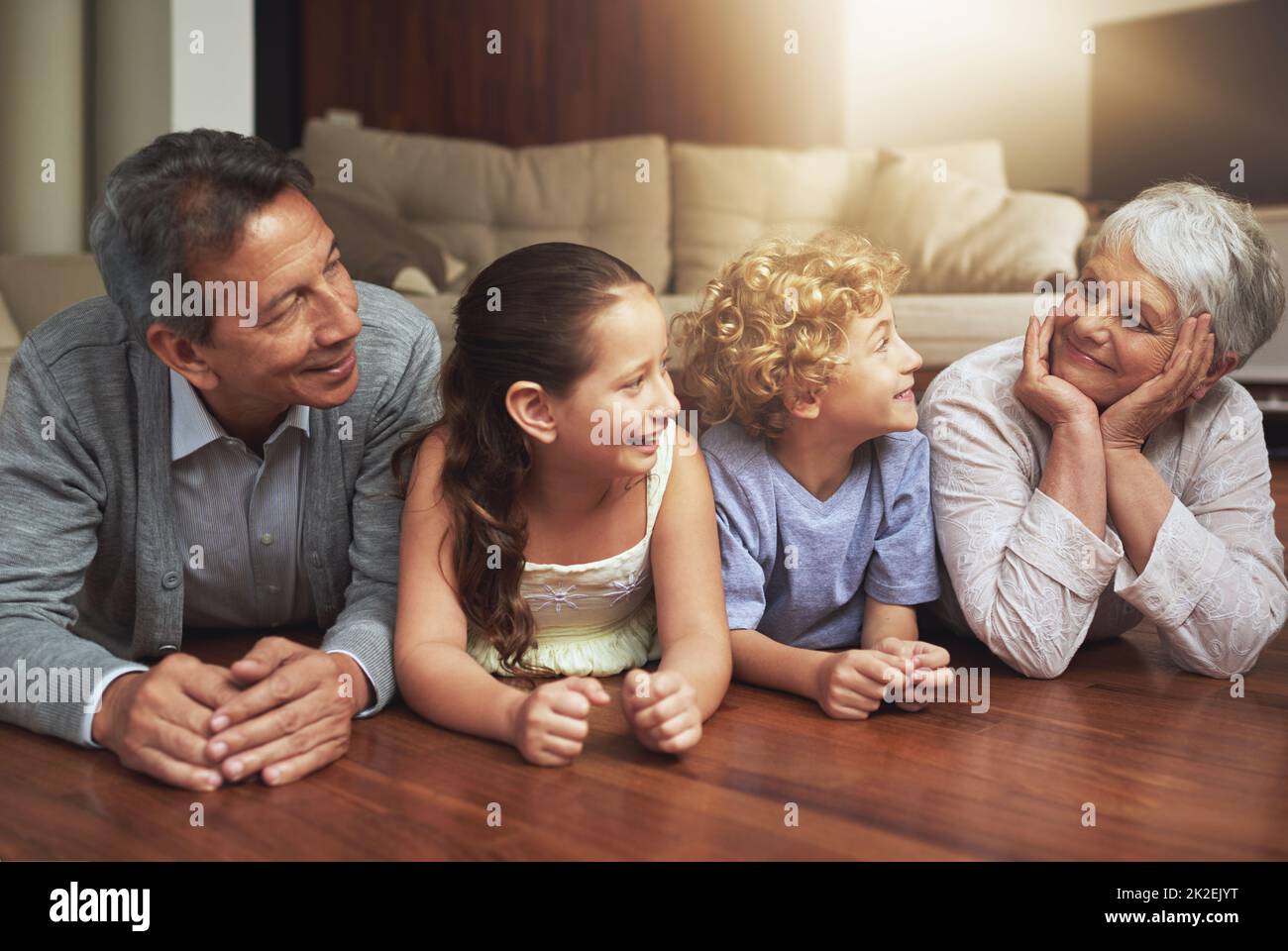 So what are we going to do next, Grandma. Shot of grandparents spending time with their grandchildren at home. Stock Photo