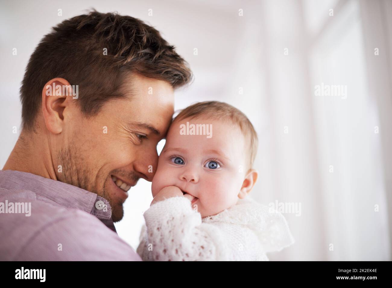 Youre my beautiful baby girl. Shot of a young father holding his ...