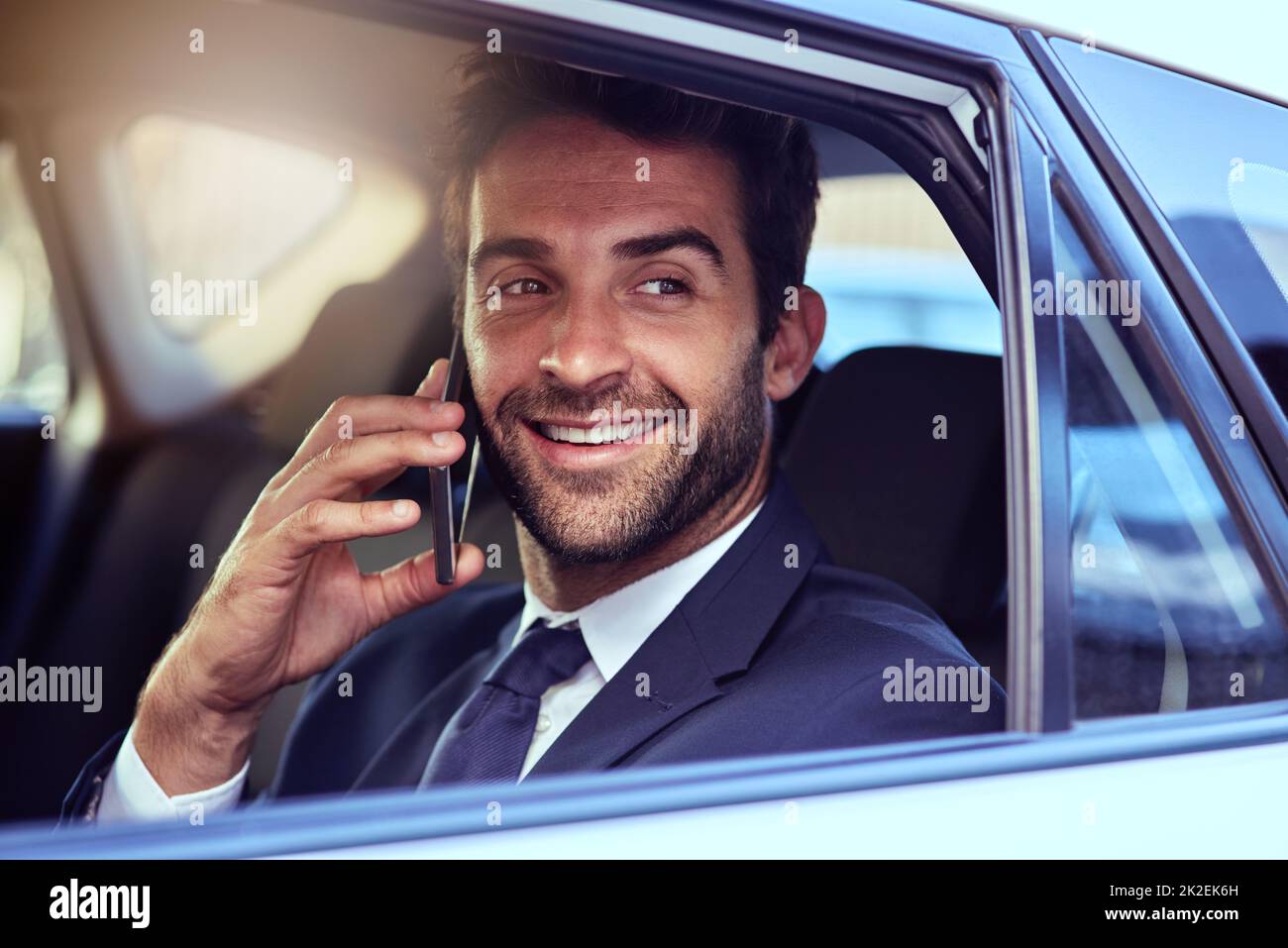 Ill be right there. Shot of a businessman talking on the phone while commuting to work. Stock Photo
