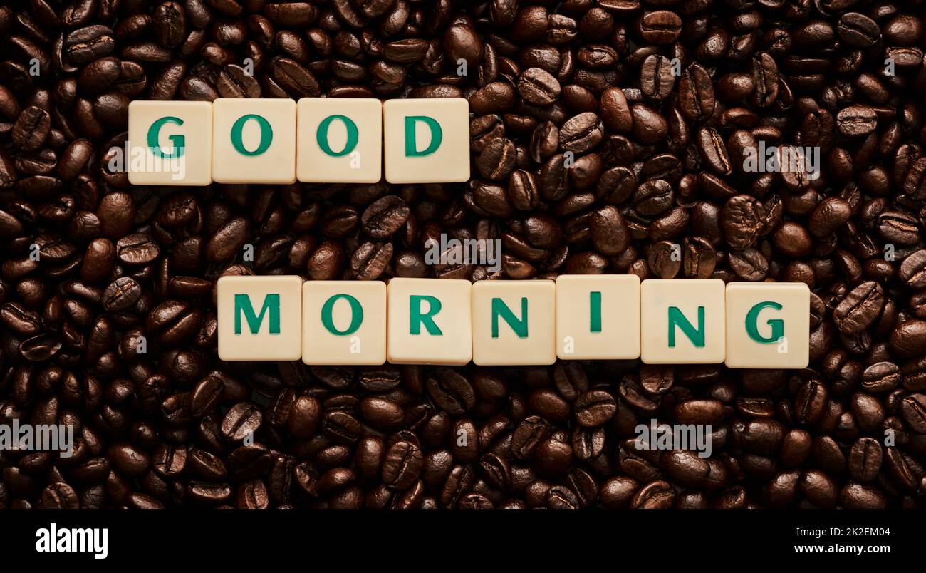 Good coffee equals good vibes. Closeup shot of block letters forming the words good morning on a pile of coffee beans. Stock Photo
