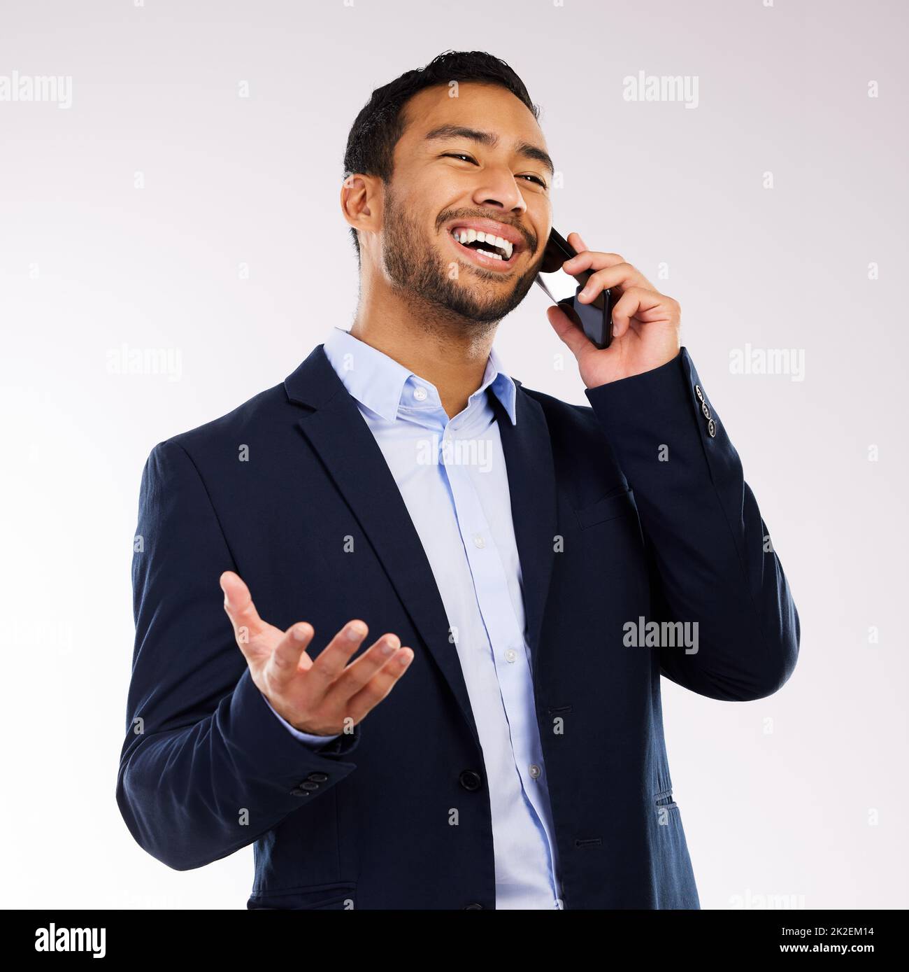 A goal is not always meant to be reached. Shot of a handsome man standing against a grey studio background and while using his cellphone. Stock Photo