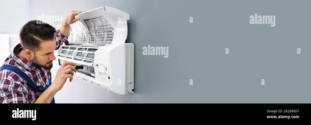 Repairer Repairing Air Conditioner Stock Photo - Alamy