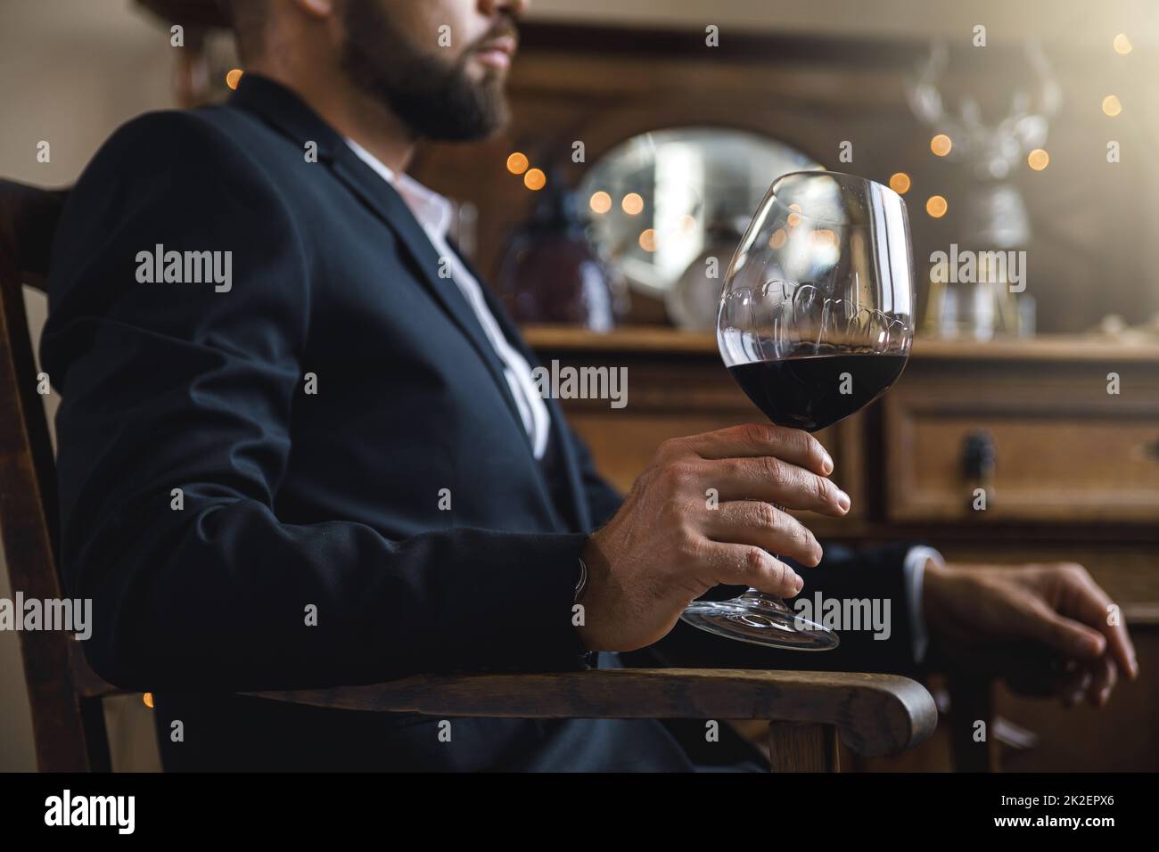 Man with a glass of red wine Stock Photo - Alamy